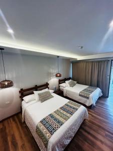 Postel nebo postele na pokoji v ubytování Hotel Dos Rios