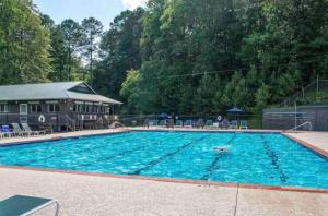 a large swimming pool with blue water at Crescent Moon on the River in Ellijay