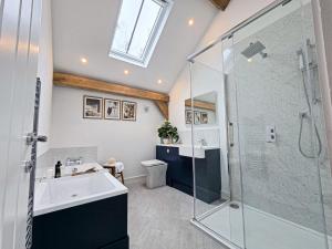 a bathroom with a sink and a shower at 4BR Country Home Near Cider Barn & Brewery in Axbridge