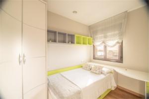 A bed or beds in a room at Apartamentos Rurales de Abelleira