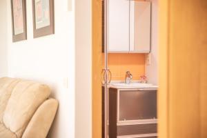 A kitchen or kitchenette at Apartamentos Rurales de Abelleira