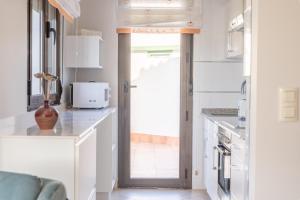 A kitchen or kitchenette at Apartamentos Rurales de Abelleira