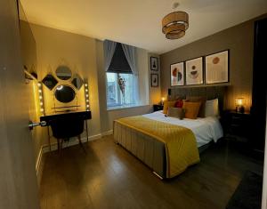 a bedroom with a bed and a window at Town Hall View in Barnsley