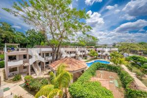 an aerial view of a resort with a pool and trees at Flor de Limon 2 in Coco