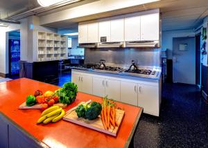 a kitchen with fruits and vegetables on a counter at HI Vancouver Jericho Beach - Hostel in Vancouver