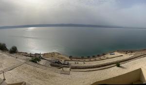 an aerial view of a beach and a body of water at O Beach Hotel & Resort in Sowayma +34 photos