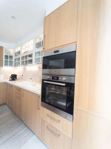 Köök või kööginurk majutusasutuses Appartement Paris La Défense Puteaux