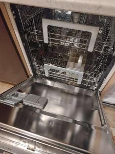 a dish rack in an oven with some dishes in it at La Finestra sul Velino, uno splendore da vivere in Rieti