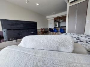 Postel nebo postele na pokoji v ubytování BOOK SANTOS - Unlimited 1710 - Beira Mar c/ vista + 37 fotografií