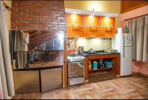 a small kitchen with a brick wall at Blue Apart 2 in Puerto Rico