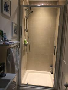 a shower stall in a bathroom with a shower at Boutique top floor apartment central Windsor in Windsor