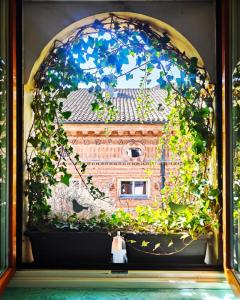 a window with a view of a brick building at Ai Tetti Carignano in Turin