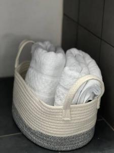 a basket filled with towels sitting on a floor at Casa 11 in Guatemala