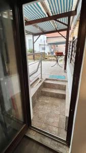 an open glass door with a view of a stairway at Das Rosenhaus in Hargesheim in Hargesheim