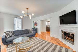 a living room with a couch and a fireplace at Elizabeth City Home with Fire Pit Less Than 1 Mi to Downtown in Elizabeth City