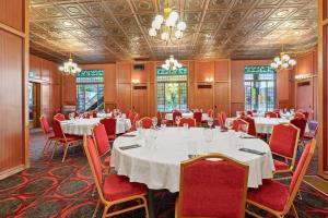 a conference room with tables and chairs and a chandelier at Crown Columbia Hotel; BW Premier Collection in Trail
