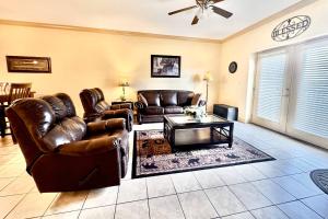 a living room with leather couches and a coffee table at Abundantly Blessed Mountain View 3604 in Pigeon Forge