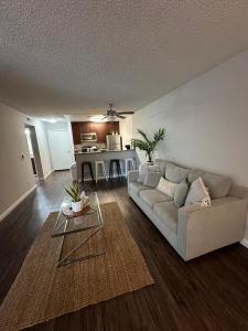 a living room with a couch and a table at Incredible Two Bedroom Hollywood Apartments FREE Parking in Los Angeles