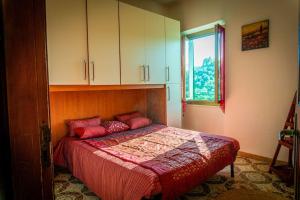 Ένα ή περισσότερα κρεβάτια σε δωμάτιο στο Appartamento Middle Earth