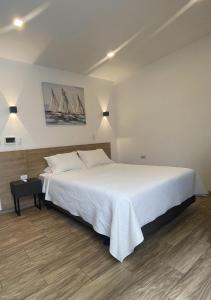 En eller flere senger på et rom på Kiran Lodging Guayaquil