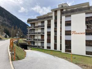 a building on the side of a road at Flaminia Wohnung 15 - Best view and Free parking! in Leukerbad