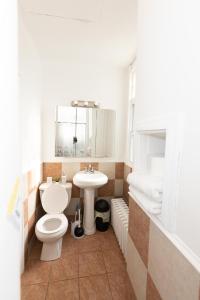 a bathroom with a toilet and a sink at 3-Bed Luxurious Home Close to NYC in Jersey City