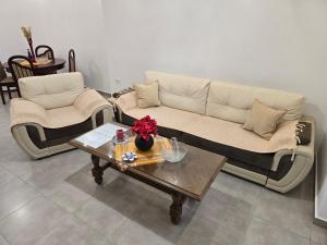 a living room with a couch and a coffee table at Apartment Angel in Kotor