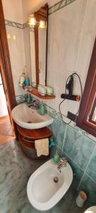 a bathroom with a sink and a mirror at Villa ANGEL in Rapallo