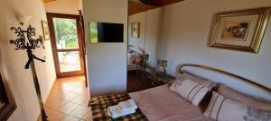 a living room with a couch and a television at Villa ANGEL in Rapallo