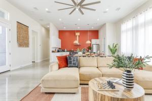 a living room with a couch and a table at Ishan by AvantStay Designer Joshua Tree Oasis in Yucca Valley