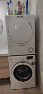 a washing machine with a sink on top of it at Bio house posto auto aria condizionata in Bologna