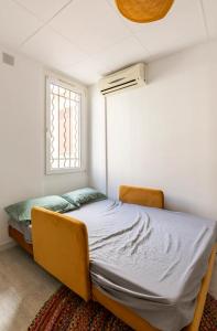 a bed in a room with a window at Artscape Marseille in Marseille