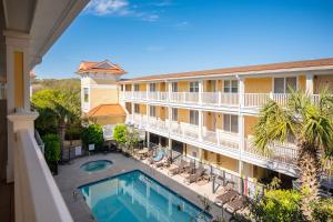 a view from the balcony of a hotel with a swimming pool at Sea Tales in Oak Island