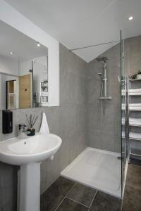a bathroom with a sink and a shower at Blackpool Central Springfield Apartments Spacious Comfort in Blackpool