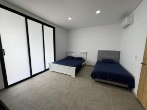 En eller flere senger på et rom på Casa De Campo Angeles