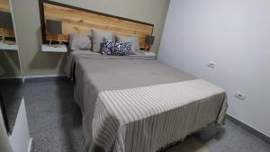 Cama o camas de una habitación en CASA JOSE "Acogedor Apartamento cerca de la playa"