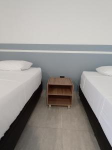 Postel nebo postele na pokoji v ubytování RB Hotel