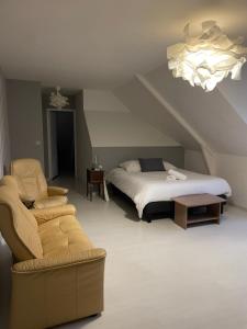 Postel nebo postele na pokoji v ubytování Les Jardins d Isaac rue de la Musardière