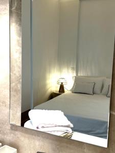 Postel nebo postele na pokoji v ubytování RESIDENZA ORTENSIA