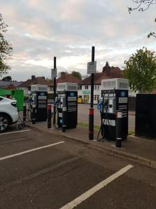 a row of gas pumps on the side of a road at Edwardian Terrace in Royal Sutton NEC BHX in Birmingham