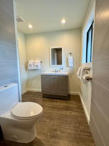 a bathroom with a toilet and a sink at Hidden Valley Inn in Carmel Valley