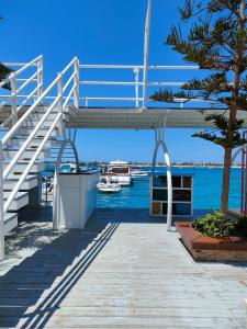 a staircase on a boat next to the water at INGOING Marina in El Alamein