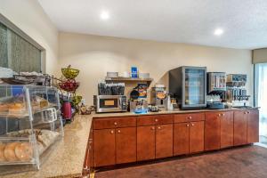 a kitchen with a counter with some food on it at Best Western Oak Manor in Biloxi