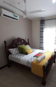 Cama ou camas em um quarto em Vipingo Nomadic Apartment