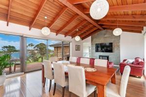 a dining room with a table and chairs at Hopkins View Holiday Home in Warrnambool