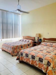 Voodi või voodid majutusasutuse Hotel Rex Ciudad Valles toas