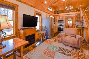 a living room with a tv and a fireplace at Just Chillin' in Blue Ridge