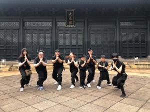 a group of people praying in front of a building at MIMARU Tokyo Ueno Okachimachi in Tokyo