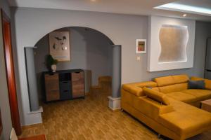 a living room with a couch and a table at Teo Apartments Luxury in Kavala