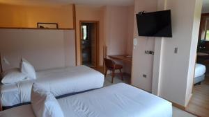 Postel nebo postele na pokoji v ubytování Calafate Apart Hotel